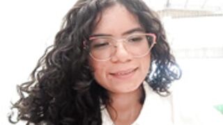 Simone Miller in a public bathroom