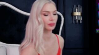 Anghhellina sucking toes and licking feet in red dress.