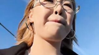 Girl shows breasts under her shirt in public