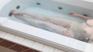 Charlotte Doe steps into the bathtub