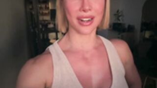 Female bodybuilder sniffs her armpits