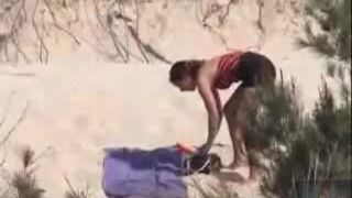 Some horny chick sunbathing on the nudist beach