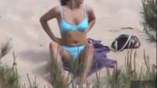 Some horny chick sunbathing on the nudist beach