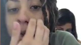 Two girls having fun on facebook live