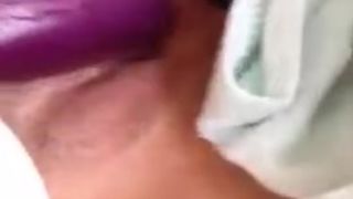 Asian girl fucking herself with an eggplant