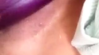 Asian girl fucking herself with an eggplant