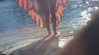 Blonde Sheds her Top in Public on River Beach as Butterfy Shed Cocoons