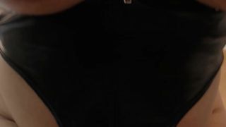 christineford in a shiny black catsuit oils her tits