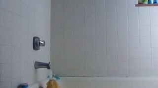 Lue fucks a dildo in the shower