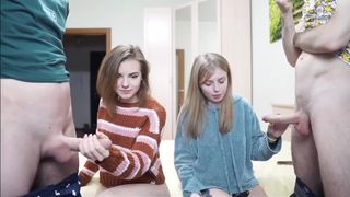 two sexy babes stroke hot cocks