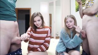 two sexy babes stroke hot cocks