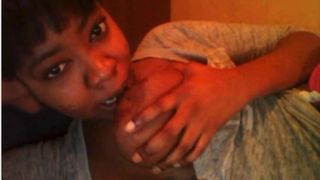 Ebony_Chick_Sucks_Her_Own_Big_Tits