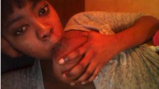 Ebony_Chick_Sucks_Her_Own_Big_Tits