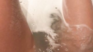 Lilly Roma is playing with her pussy in the bathtub