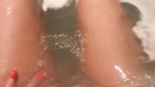 Lilly Roma is playing with her pussy in the bathtub