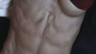 Shredded Milf flexing abs