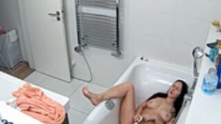 Leora takes a shower and masturbates