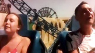 Titties popping out during a roller coaster ride