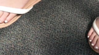 Arabic teen dangling flip flops in class