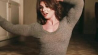 Redhead FBB bulges through her shirt. Wow!