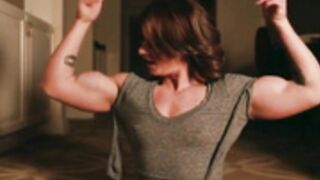 Redhead FBB bulges through her shirt. Wow!