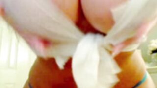 Young Gisele dancing in torn white T