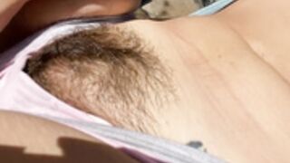 Hairy girl sunbathing outdoor