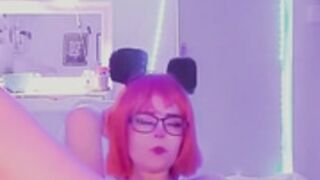 Girl in wig and glasses masturbates
