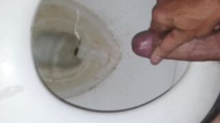 Cumshot into friends toilet