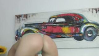 green lingerie removes bra and dances topless