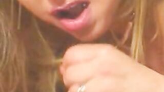 Blonde gives handjob and strokes cum onto her big tits